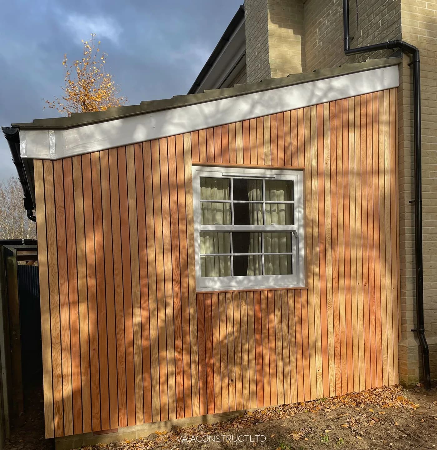 Close detail of vertical timber cladding and window finish